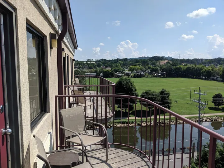 View from a Riverside Tower balcony over the green space and Little Pigeon River